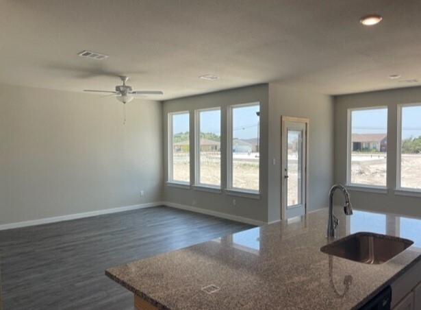 20107 Park Strip Street, Unit A Lago Vista, TX 78645 - Photo 15 of 15 a view of livingroom with hardwood floor and a ceiling fan