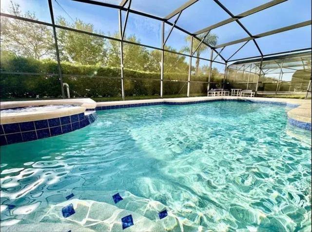 a view of a swimming pool with a patio