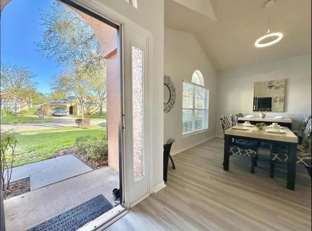 a view of a porch with furniture and garden