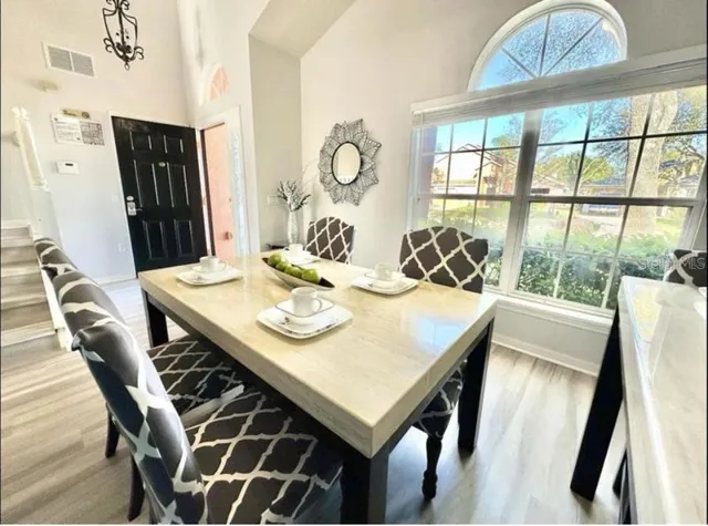 a view of a dining room with furniture window and outside view