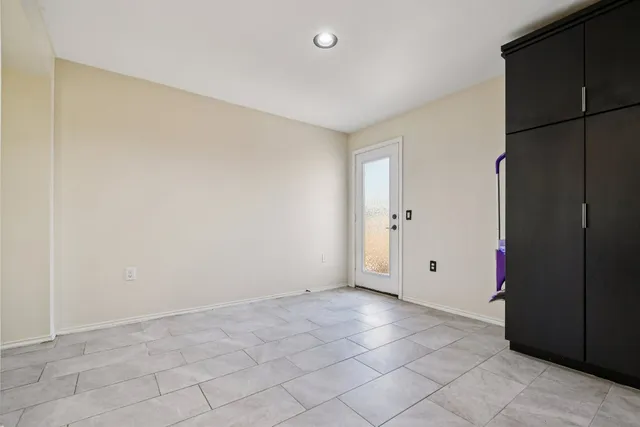 a bathroom with a granite countertop sink a toilet and a shower