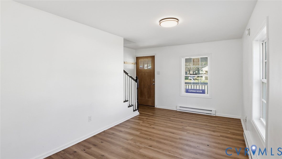 205 Cobb Street Franklin, VA 23851 - Photo 19 of 57 an empty room with wooden floor and a window