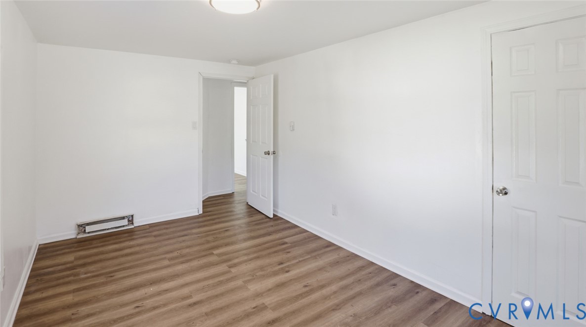 205 Cobb Street Franklin, VA 23851 - Photo 21 of 57 a view of an empty room with wooden floor