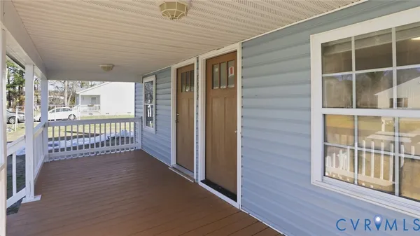 a view of a balcony with wooden floor