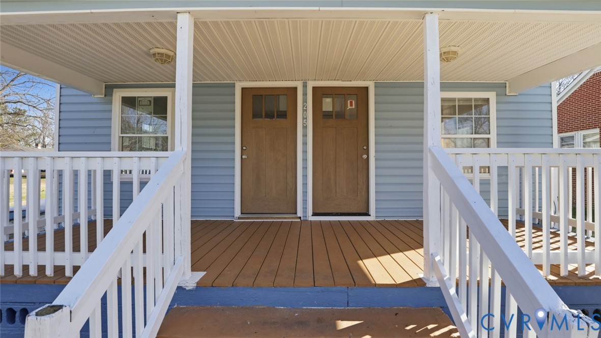 205 Cobb Street Franklin, VA 23851 - Photo 24 of 57 a view of a balcony with wooden floor