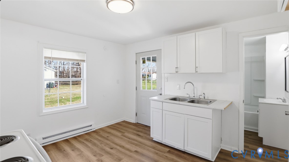 205 Cobb Street Franklin, VA 23851 - Photo 26 of 57 a room with a sink cabinets and wooden floor