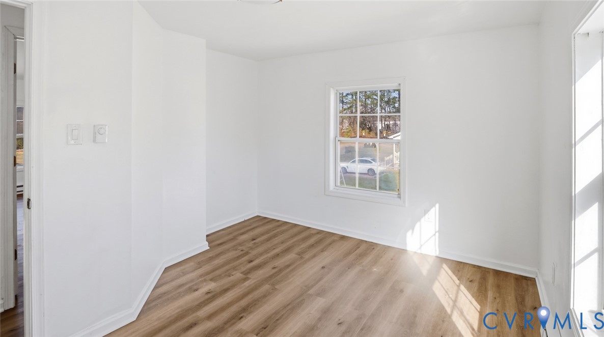 205 Cobb Street Franklin, VA 23851 - Photo 29 of 57 a view of a big room with wooden floor and windows