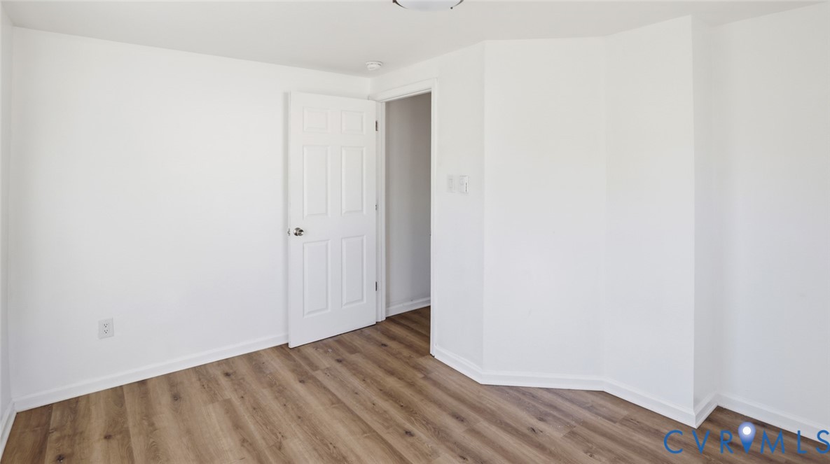205 Cobb Street Franklin, VA 23851 - Photo 30 of 57 a view of an empty room with wooden floor