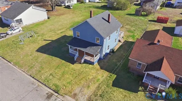 an aerial view of a house with swimming pool