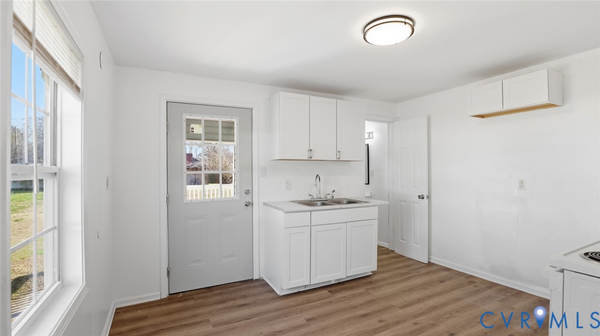 205 Cobb Street Franklin, VA 23851 - Photo 34 of 57 a room view with wooden floor and window