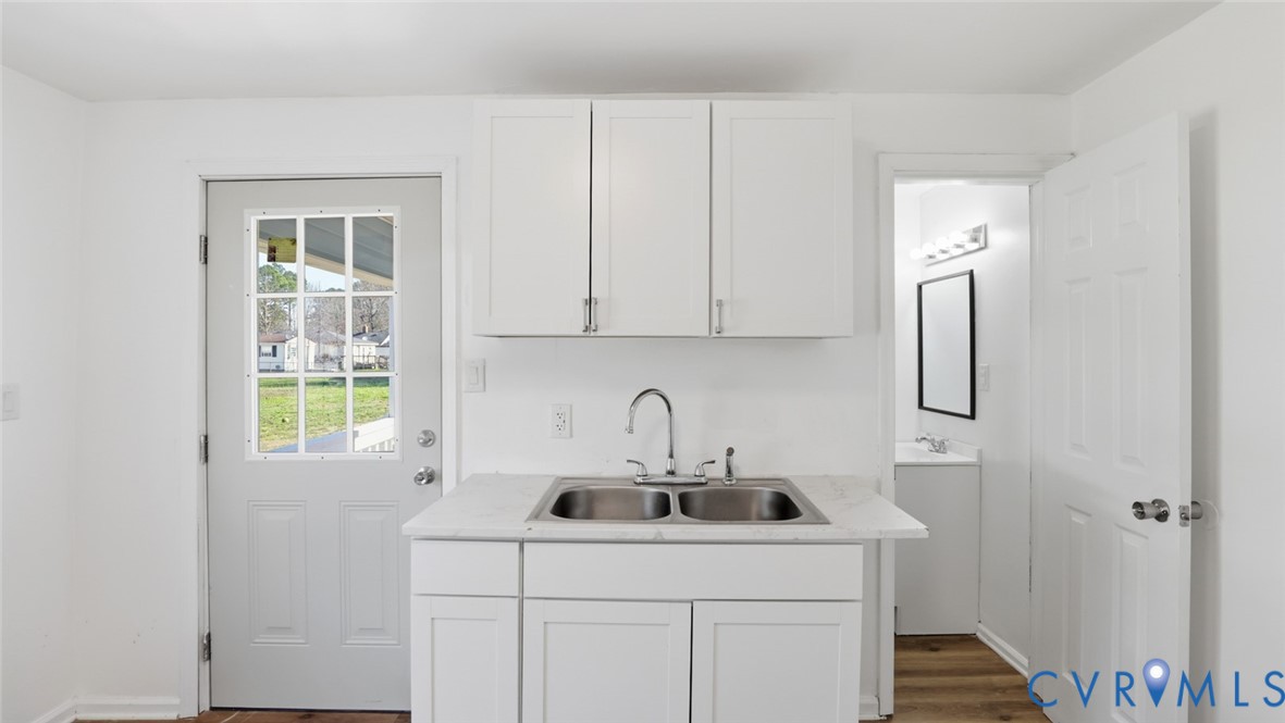 205 Cobb Street Franklin, VA 23851 - Photo 36 of 57 a kitchen with a sink cabinets and window