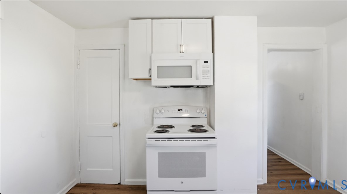 205 Cobb Street Franklin, VA 23851 - Photo 37 of 57 Kitchen featuring white appliances, white cabinetr