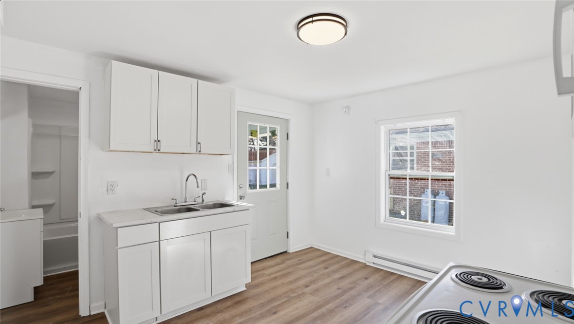 205 Cobb Street Franklin, VA 23851 - Photo 48 of 57 a kitchen with a sink cabinets and wooden floor