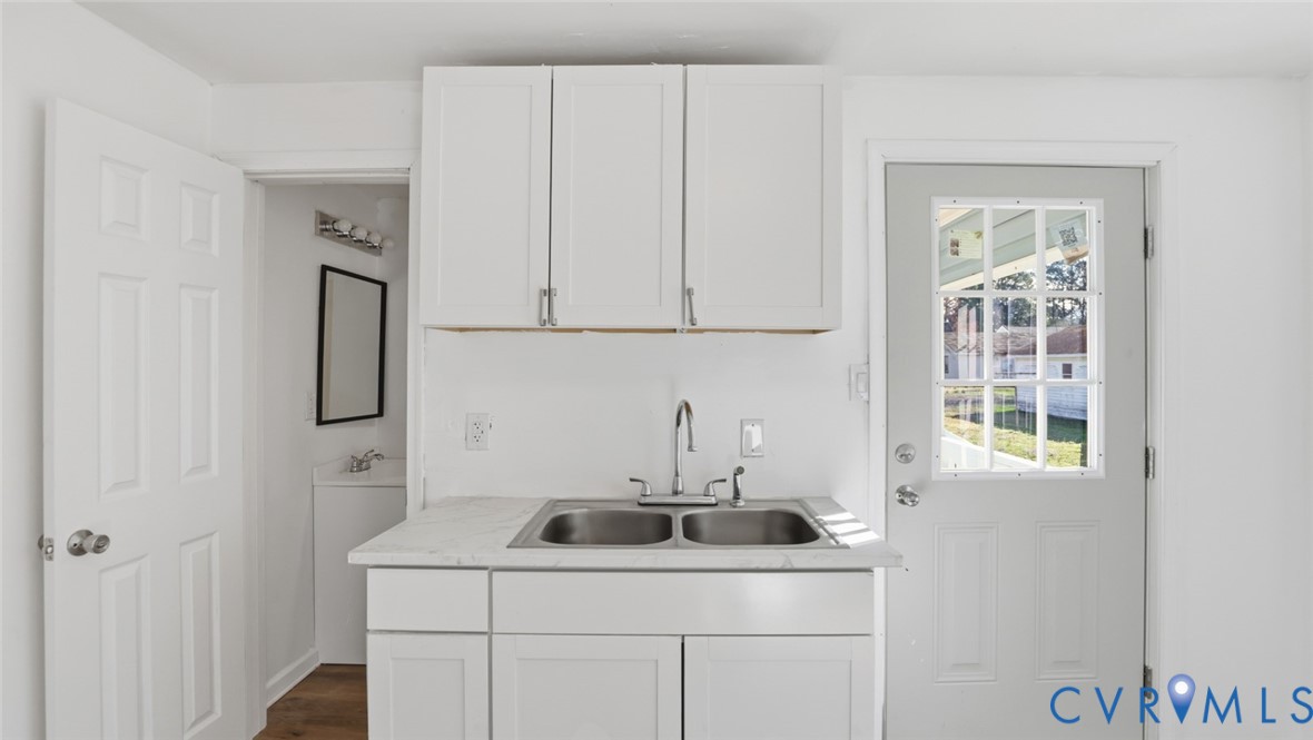 205 Cobb Street Franklin, VA 23851 - Photo 49 of 57 a utility room with a sink dryer and washer