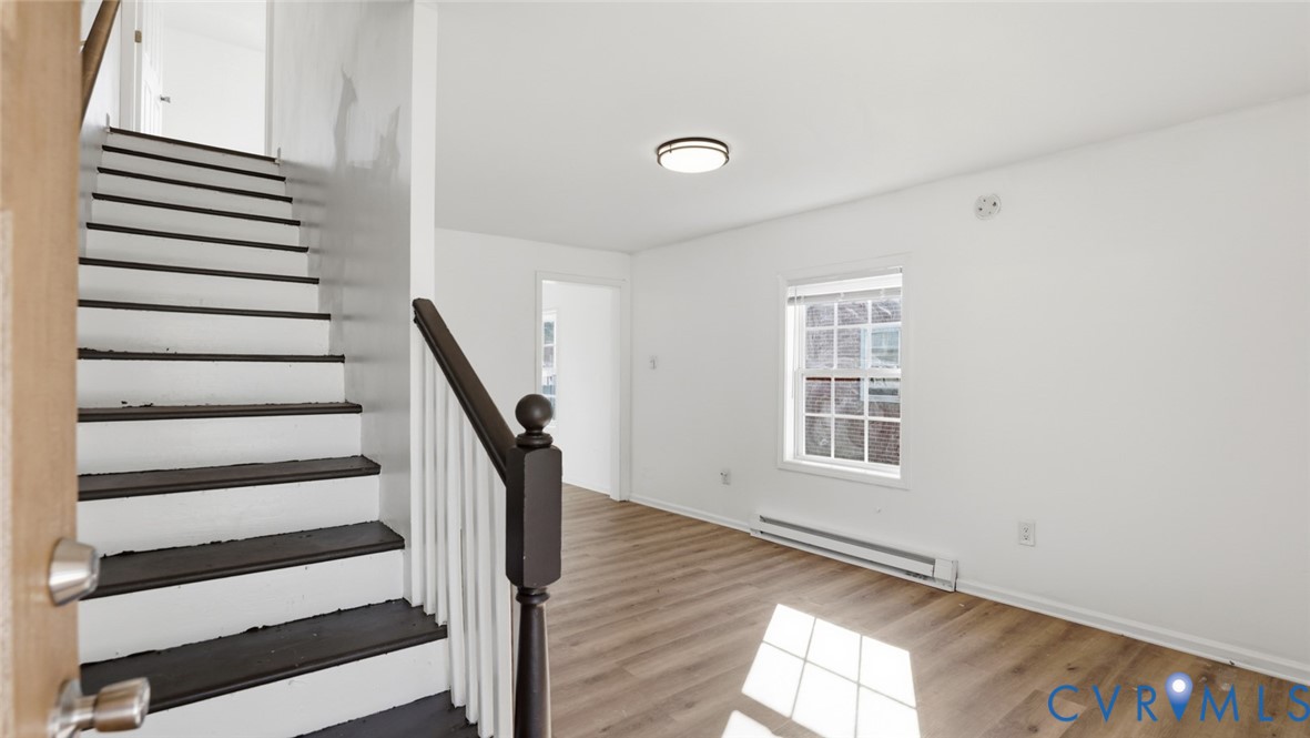 205 Cobb Street Franklin, VA 23851 - Photo 52 of 57 a view of a room with stairs and wooden floor