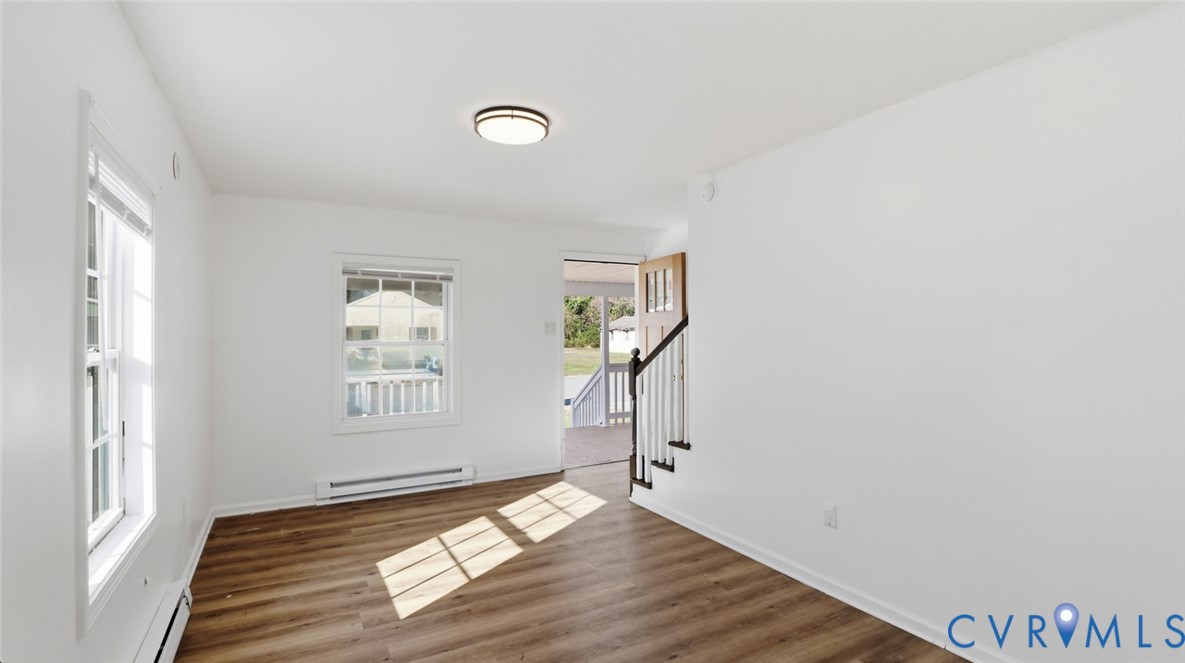 205 Cobb Street Franklin, VA 23851 - Photo 57 of 57 a view of empty room with wooden floor and fan