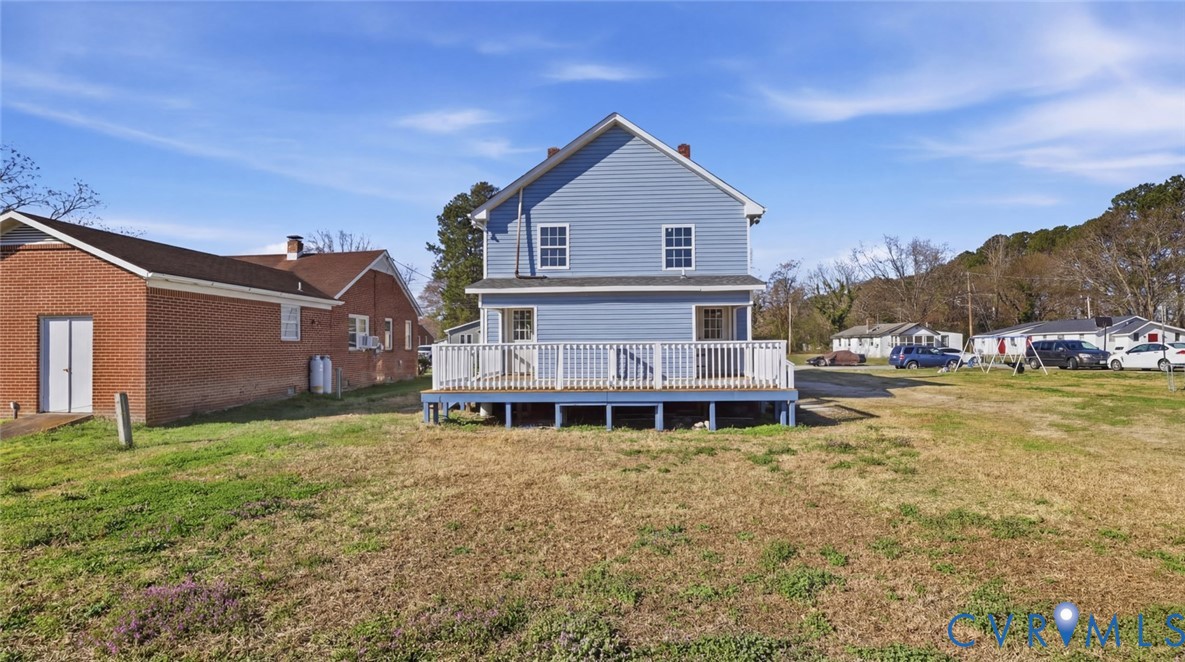 205 Cobb Street Franklin, VA 23851 - Photo 7 of 57 a view of a house with a big yard and large trees
