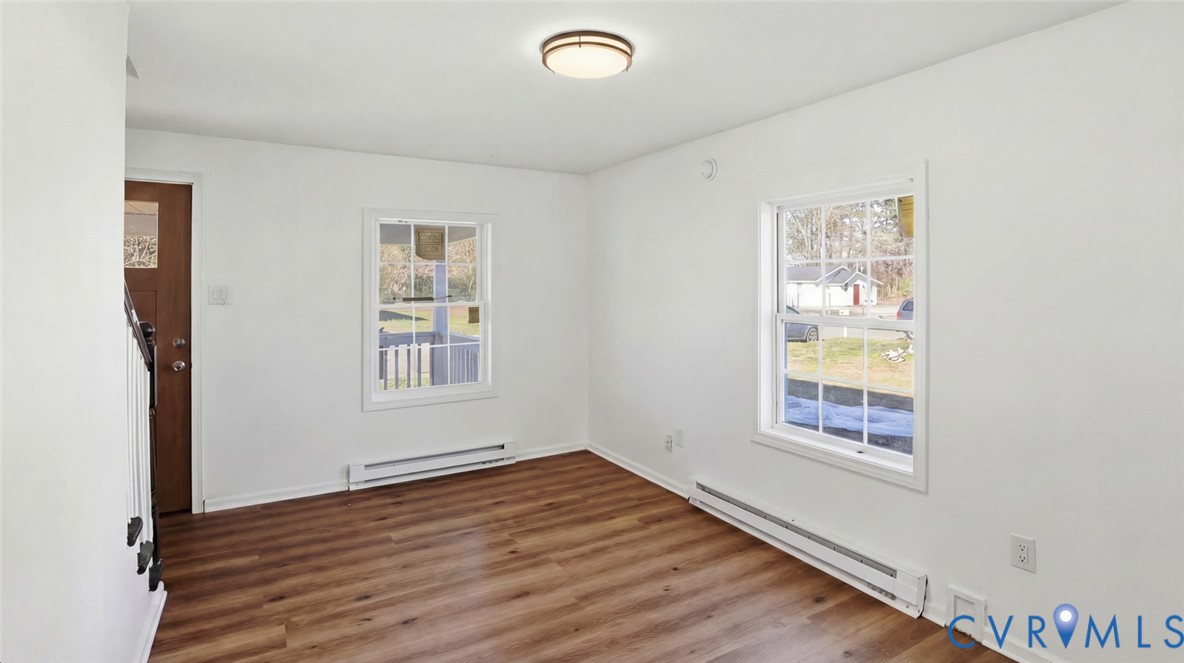 205 Cobb Street Franklin, VA 23851 - Photo 9 of 57 an empty room with windows