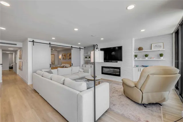 a bedroom with a bed and a ceiling fan