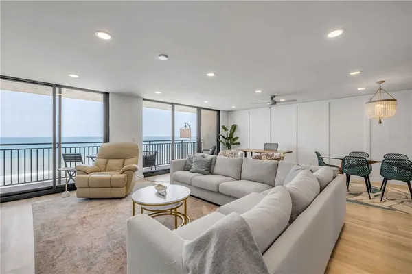 a living room with furniture fireplace and a flat screen tv