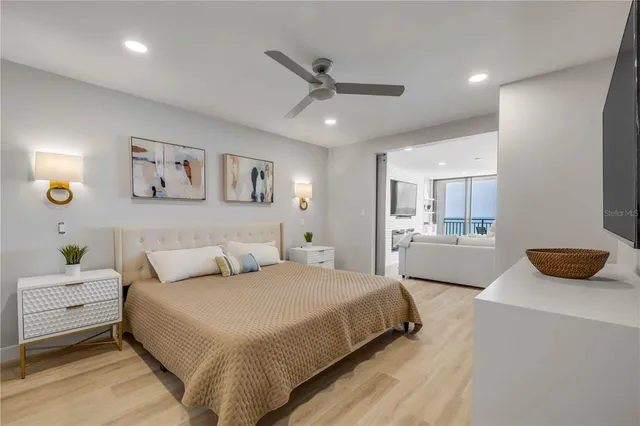 a balcony with wooden floor and outdoor seating