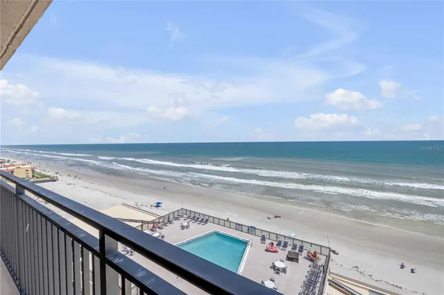 a view of a balcony with an ocean view