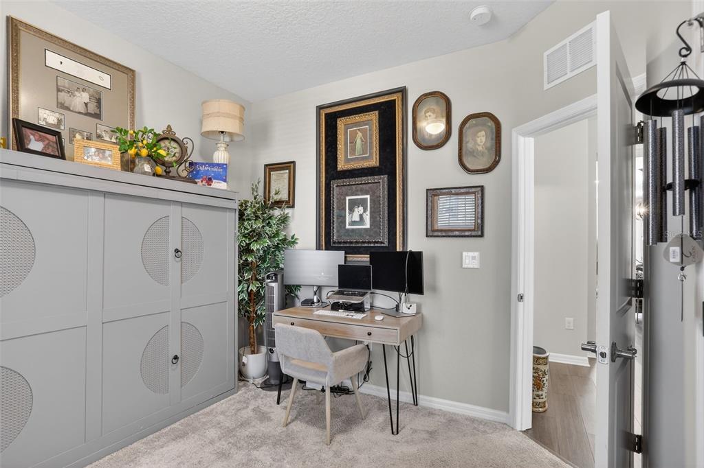 2222 Gopher Tortoise Terrace Oakland, FL 34787 - Photo 18 of 51 a very nice looking room with a table and a clock