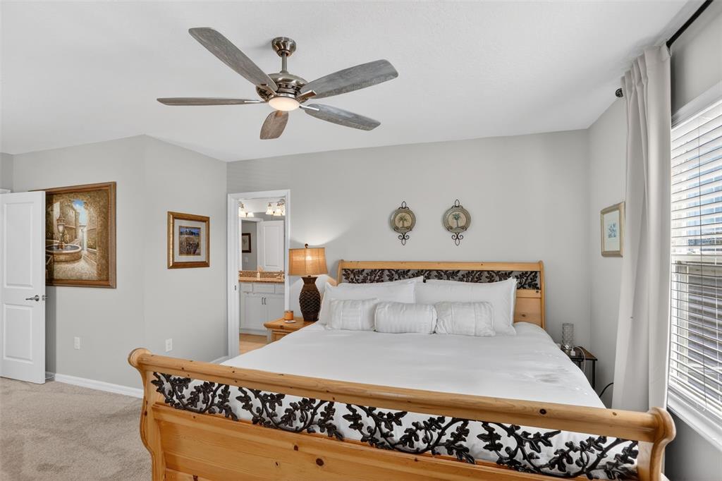 2222 Gopher Tortoise Terrace Oakland, FL 34787 - Photo 24 of 51 a bedroom with a bed and window
