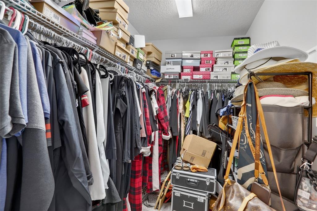 2222 Gopher Tortoise Terrace Oakland, FL 34787 - Photo 25 of 51 a view of walk in closet with clothes