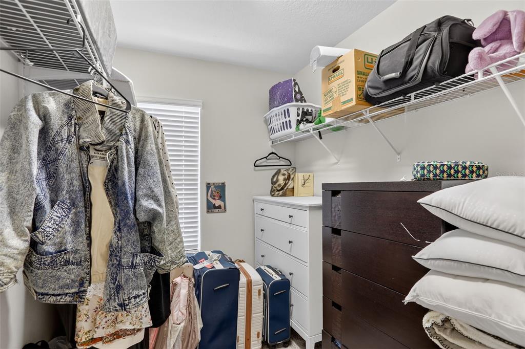 2222 Gopher Tortoise Terrace Oakland, FL 34787 - Photo 36 of 51 a view of walk in closet with clothes and shoes
