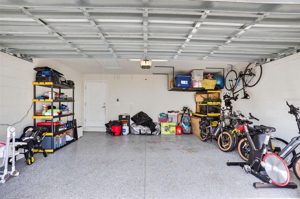 2222 Gopher Tortoise Terrace Oakland, FL 34787 - Photo 43 of 51 a view of a garage with a bike and a garage