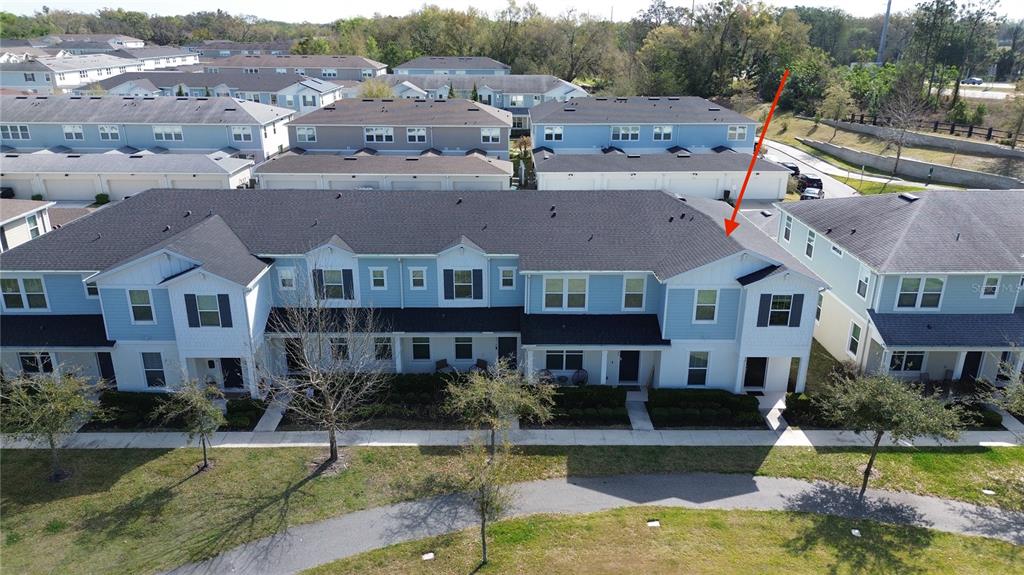 2222 Gopher Tortoise Terrace Oakland, FL 34787 - Photo 49 of 51 an aerial view of residential houses with yard and lake view