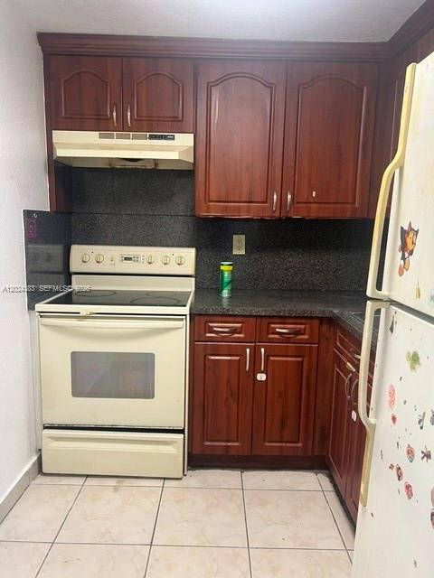 666 West 81st Street, Unit 103 Hialeah, FL 33014 - Photo 1 of 12 a stove top oven sitting inside of a kitchen