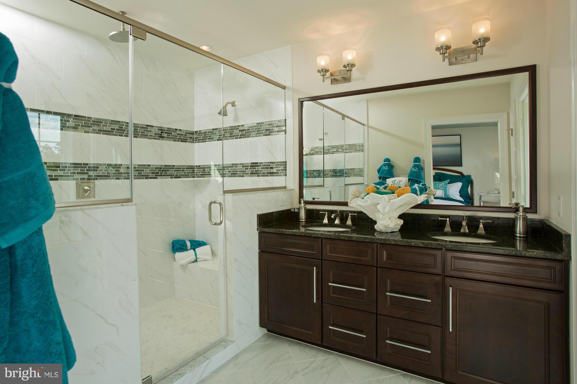2530 Cherry Tree Road Hanover, MD 21076 - Photo 9 of 19 a bathroom with a tub sink and mirror