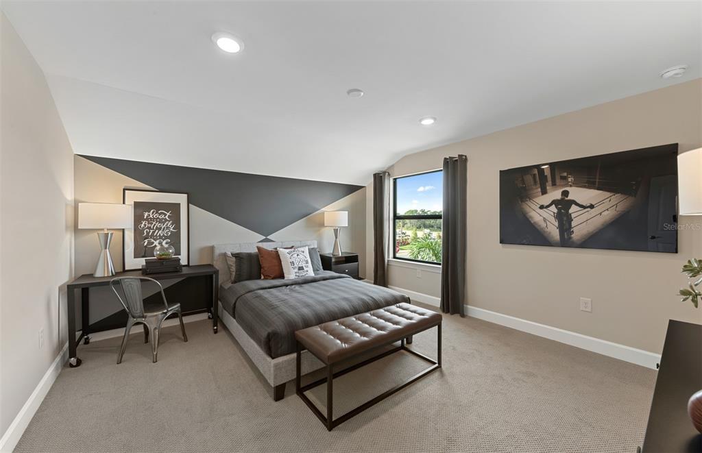 16427 Sapphire Point Drive Lakewood Ranch, FL 34211 - Photo 22 of 30 a spacious bedroom with a bed and window