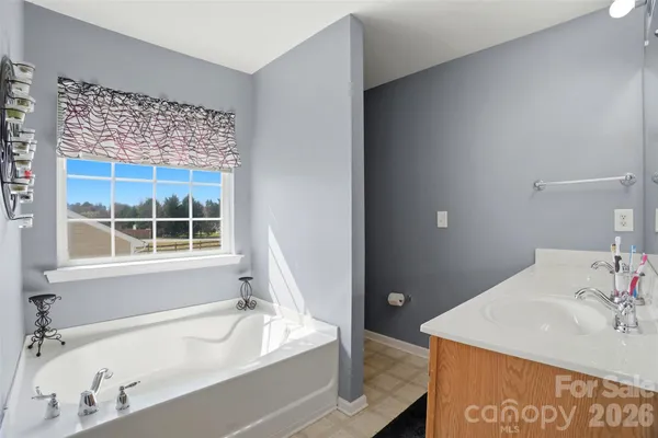 a bath room with a sink and a bath tub