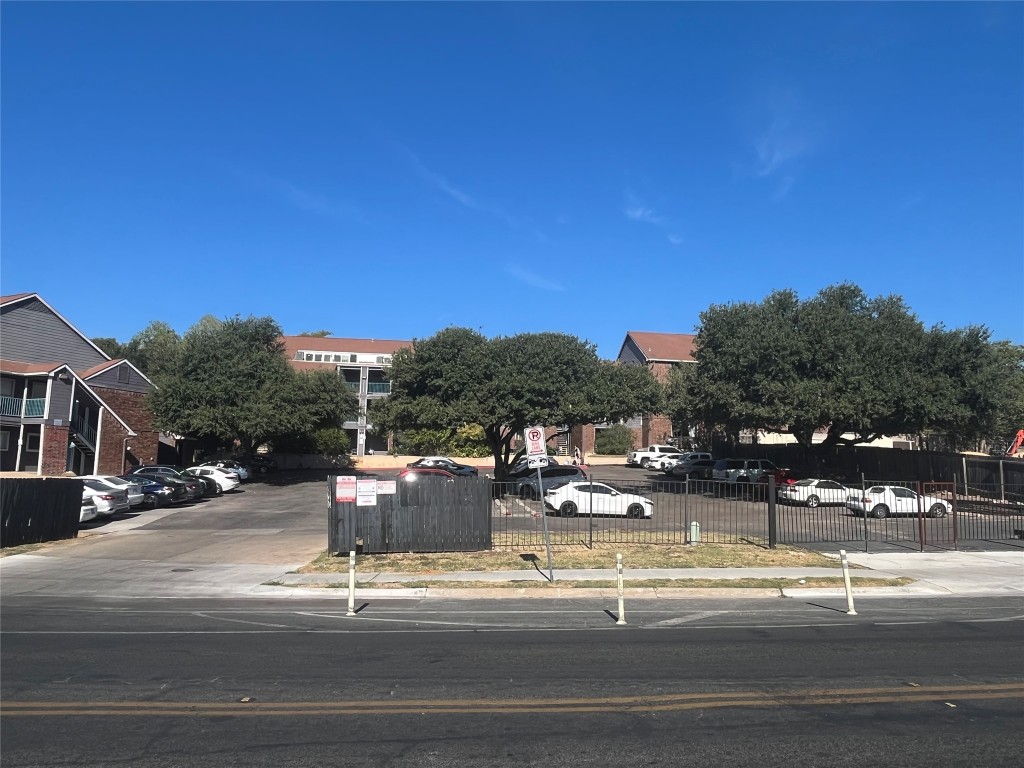 1840 Burton Drive, Unit 184 Austin, TX 78741 - Photo 14 of 23 View of asphalt road featuring sidewalks and curbs