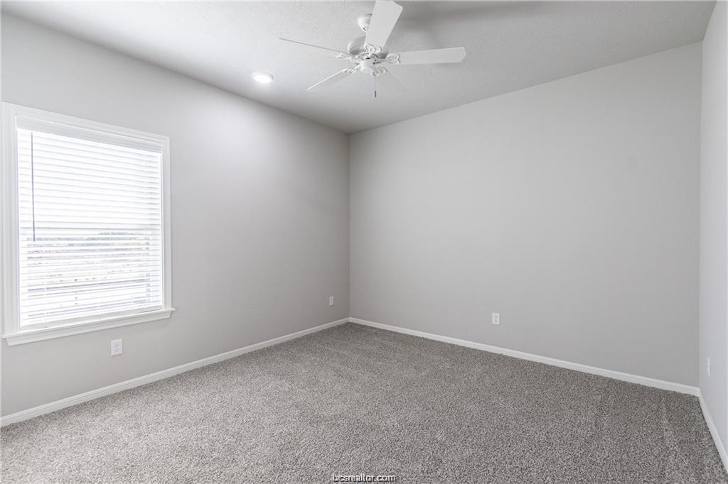 1326 Prairie Drive, Unit 623 Bryan, TX 77803 - Photo 14 of 21 an empty room with a window and a fan