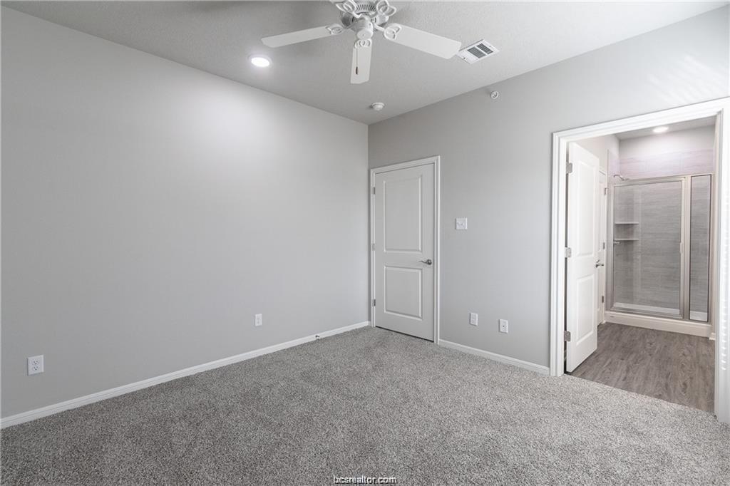 1326 Prairie Drive, Unit 623 Bryan, TX 77803 - Photo 15 of 21 an empty room with fan and entrance