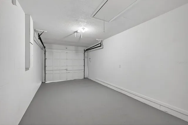 a view of a big room with closet and windows