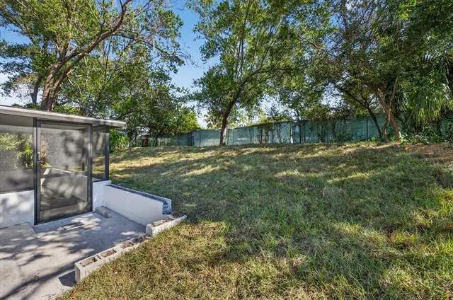an aerial view of a house with a yard and garden