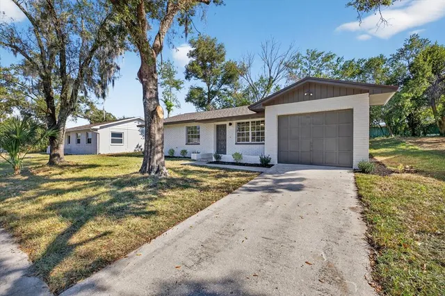 front view of a house with a yard