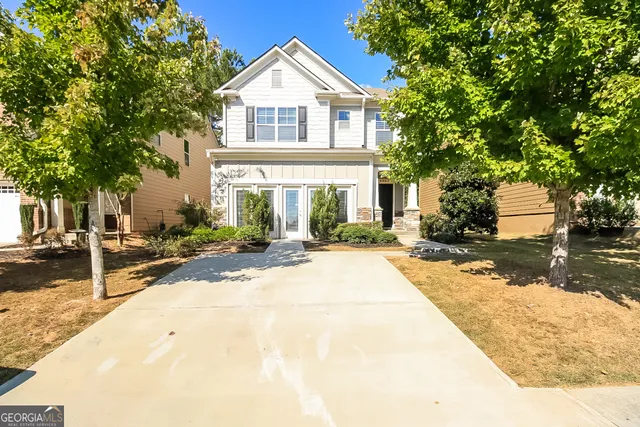 a front view of a house with a yard
