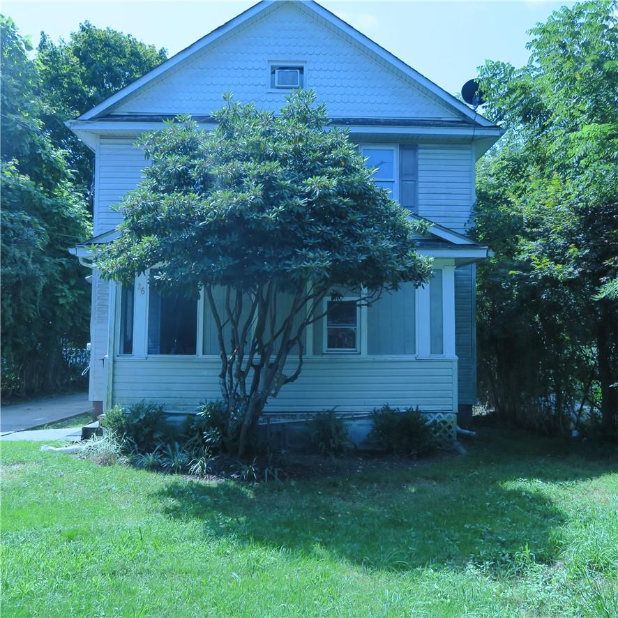 26 Orchard Street Spring Valley, NY 10977 - Photo 1 of 1 View of front of house featuring a front lawn