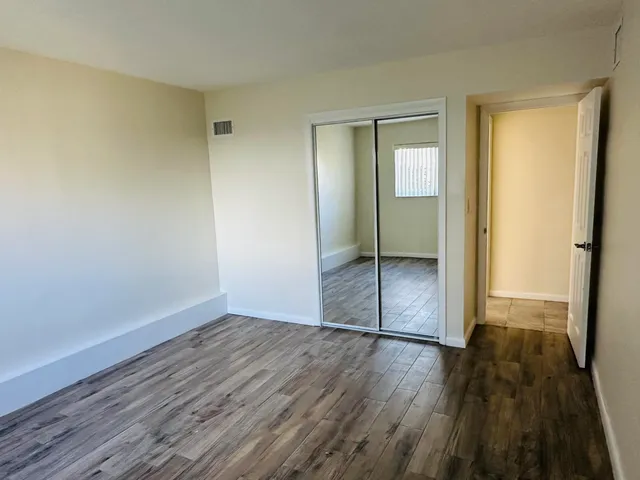 a view of wooden floor in an empty room