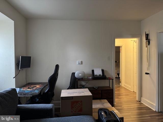 117 East Walnut Avenue, Unit F Merchantville, NJ 08109 - Photo 9 of 19 a view of a workspace with furniture and wooden floor