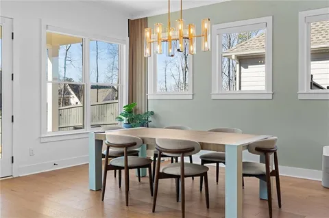 a living room with couch and a potted plant