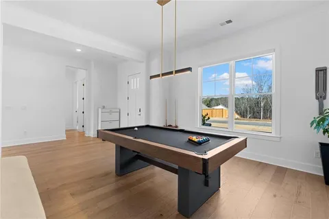 a bed room with a bed and a chair