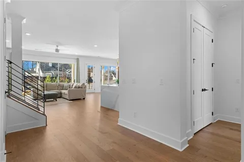 a bedroom with a bed and a dresser next to a window