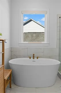 a bedroom with a bed and a mirror